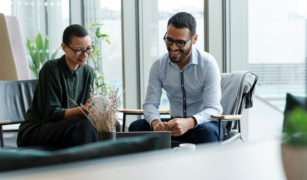 Two colleagues discussing results of NPS survey